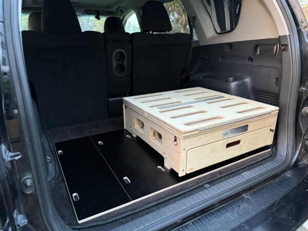 Trunk Mate’s sleek wooden storage box, featuring handy ventilation slots, fits perfectly in the back of an SUV with the seats down — ready to organize your gear and keep things fresh on every adventure.
