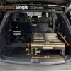 SUV trunk fitted with a BlitzBed Single (0-Drawer) platform, displayed folded to highlight its compact 8-inch height, 24-inch width and depth, 21.5-inch base length, and 4.5-inch clearance—perfect for maximizing sleep space while keeping your cargo area organized.