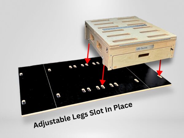 Wooden Trunk Mate storage box with slotted openings sits above a sleek black base panel; red arrows show how the adjustable legs easily slot into place for quick setup. Text overlay reads: "Adjustable Legs Slot In Place.