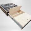Trunk Mate platform: wooden drawer system shown partially open, with inner storage sections and a hinged lid, on a plain backdrop.