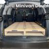 BlitzBed Minivan Double wooden platform set up in a minivan; measurements and adjustable height and length features displayed.