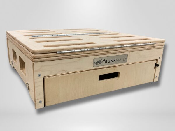 A sturdy Trunk Mate wooden storage box with handy side handles, a front pull-out drawer, ventilation slots for airflow, and a hinged lid—all designed for organized car camping and shown on a simple neutral backdrop.