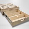 Trunk Mate Sleeping Platform storage drawer unit with convenient dividers, easy-grab cut-out handles, and ventilation slots on the top—shown partially pulled out for smart access.