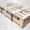 Back view of the Trunk Mate Sleeping Platform, highlighting its sturdy wooden construction, slotted cutouts for airflow and gear access, durable metal handles, and secure black straps—all ready for your next adventure.