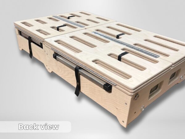 Back view of the Trunk Mate Sleeping Platform, highlighting its sturdy wooden construction, slotted cutouts for airflow and gear access, durable metal handles, and secure black straps—all ready for your next adventure.