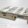 A Trunk Mate wooden storage platform featuring ventilation slots, a spacious pull-out drawer, sturdy handles, and secure straps—everything you need for organized car camping. Shown from the front with the bold "TRUNK MATE" logo visible against a simple backdrop.