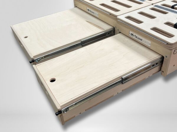 Two wooden sliding panels on sturdy metal rails, smoothly extending from the Trunk Mate modular sleeping platform, spotlighting our signature easy-slide design against a simple backdrop.