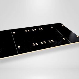 A Trunk Mate Sleeping Platform panel in matte black, featuring precision-cut slots and holes for versatile setups, displayed on a clean light gray background.